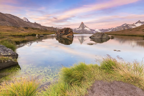 Sunrise on the shores of Stellisee Lake in front of Matterhorn, Zermatt, Switzerland.