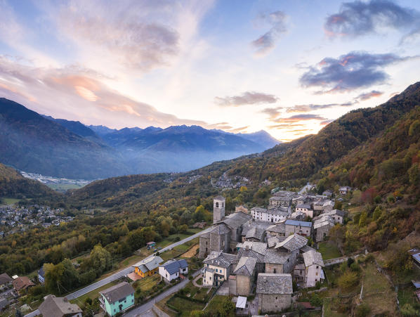 Panoramic of the village of Caspano at sunset, Costiera dei Cech, Sondrio province, lower Valtellina, Lombardy, Italy