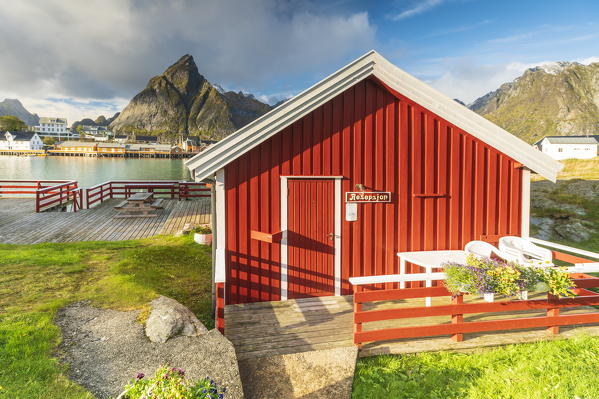 Traditional red cabin on wood deck, Sakrisoy, Reine, Nordland, Lofoten Islands, Norway