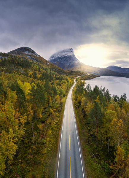 Aerial panoramic of the coastal Road E6 (European Route) towards Krakmotinden mountain in autumn, Innhavet, Nordland, Norway