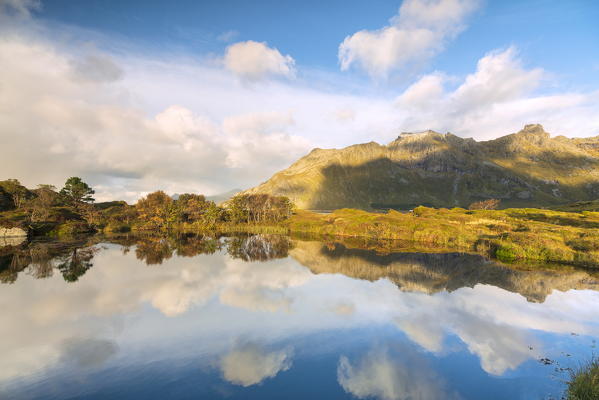 Mountains mirrored in water, Fredvang, Nordland county, Lofoten Islands, Norway