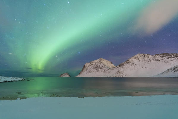 Aurora Borealis over Haukland beach covered with snow, Vestvagoy, Nordland, Lofoten Islands, Norway