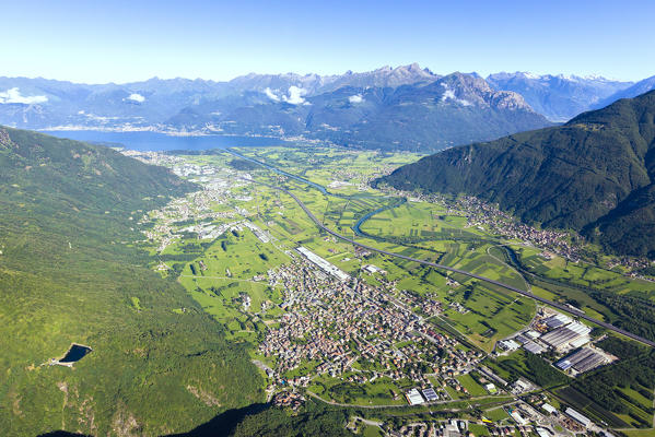 Hang gliding over the village of Delebio, lower Valtellina, Sondrio province, Lombardy, Italy