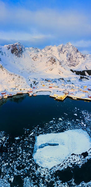 Aerial panoramic of the icy sea and harbor, Ballstad, Vestvagoy, Lofoten Islands, Norway