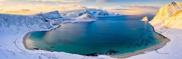 Aerial panoramic of Haukland beach covered with snow, Vestvagoy, Nordland, Lofoten Islands, Norway