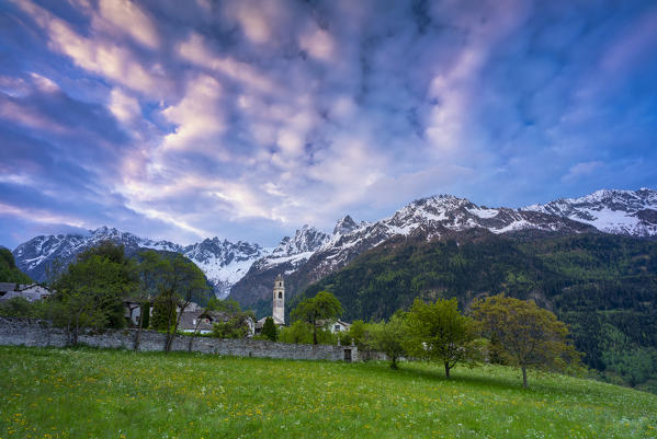 Clouds at sunrise over the alpine village of Soglio, Bregaglia Valley, canton of Graubunden, Switzerland