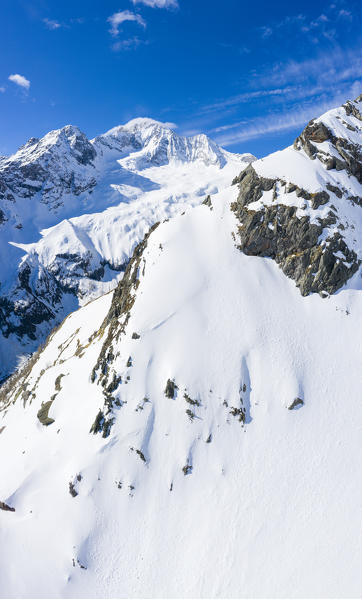 Aerial panoramic of Monte Disgrazia covered with snow in spring, Valmalenco, Valtellina, Sondrio province, Lombardy, Italy