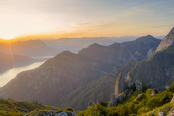 Aerial view of sunset over Lake Como and Grignetta (Grigna Meridionale) from Rifugio Rosalba, Lecco province, Lombardy, Italy