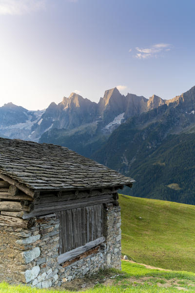 Stone hut with Piz Cengalo and Badile in background, Tombal, Soglio, Val Bregaglia, canton of Graubunden Switzerland