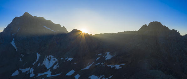 Silhouettes of Corno dei Tre Signori at dawn, aerial view, Gavia Pass, Valfurva, Valtellina, Sondrio province, Lombardy, Italy