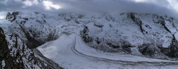 Panoramic of dramatic sky over Monte Rosa Glacier and snowcapped mountains, Zermatt, canton of Valais, Switzerland