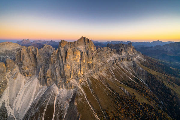 Warm light of sunset on Torri Del Vajolet and Catinaccio in autumn, Catinaccio Group, aerial view, Dolomites, South Tyrol, Italy