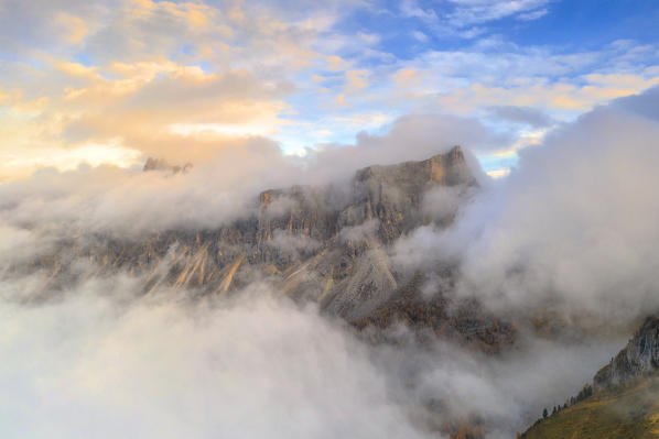 Aerial view of sunset over Lastoi De Formin emerging from mist, Giau Pass, Dolomites, Belluno province, Veneto, Italy