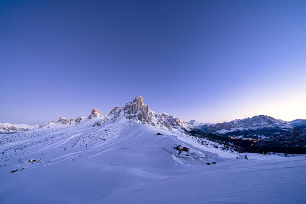 Dusk on Ra Gusela mountain surrounded by fresh snow, Giau Pass, Dolomites, Belluno province, Veneto, Italy