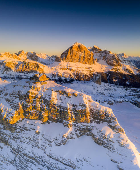 Sunrise on Rifugio Nuvolau and Tofana di Rozes covered with snow, aerial view, Dolomites, Belluno province, Veneto, Italy