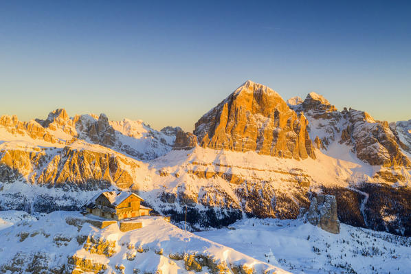 Aerial panoramic of Rifugio Nuvolau and Tofane at sunrise in winter, Dolomites, Belluno province, Veneto, Italy