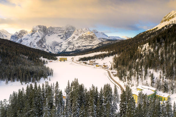 Aerial view of Sorapis group and Lake Misurina covered with snow, Dolomites, Auronzo di Cadore, Veneto, Italy