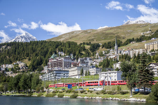 The Bernina Express passing by Saint Moritz, Engadine, Switzerland Europe