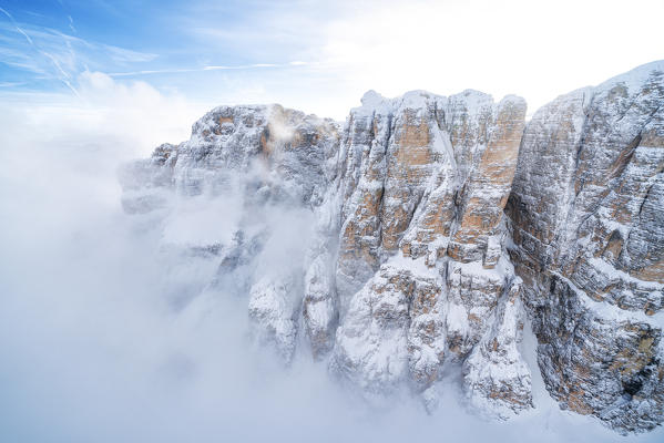 Mist over the majestic mountains of Sella Group, Dolomites, South Tyrol, Italy