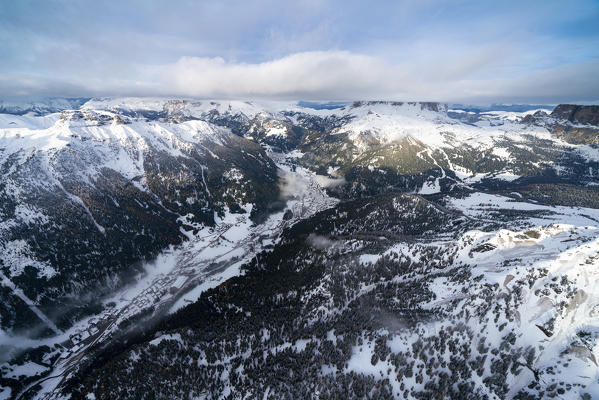 Winter aerial view of Alba and Canazei, Val di Fassa, Dolomites, Trentino-Alto Adige, Italy