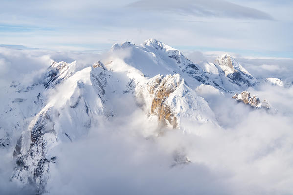 Clouds surrounding the snowcapped Marmolada, aerial view, Dolomites, Trentino-Alto Adige, Italy