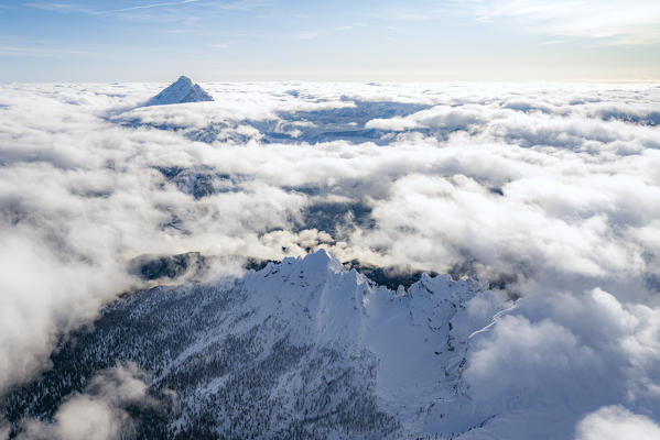 Aerial view of  snow capped Monte Antelao and clouds, Dolomites, Belluno province, Veneto, Italy