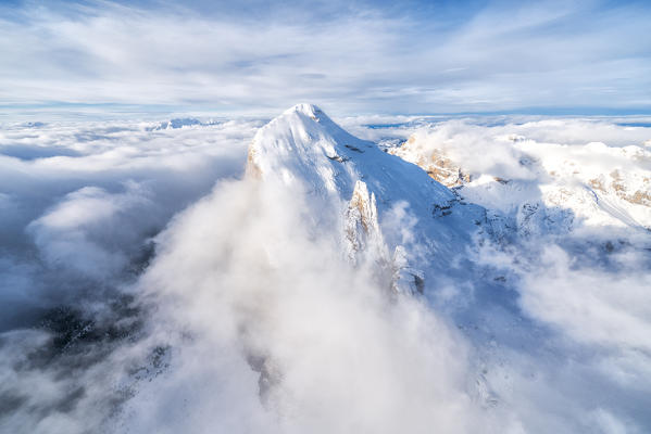 Snow covered Tofana di Rozes in the clouds, aerial view, Dolomites, Belluno province, Veneto, Italy