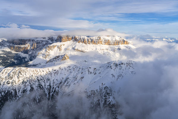 Aerial view of Pordoi Pass and Sass Pordoi covered with snow, Sella Group, Dolomites, Trentino-Alto Adige, Italy