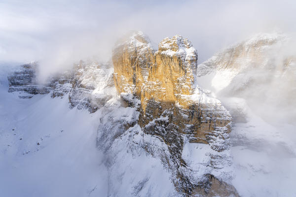 Aerial view of Sella Group surrounded by snow, Gardena Pass, Dolomites, Trentino-Alto Adige, Italy