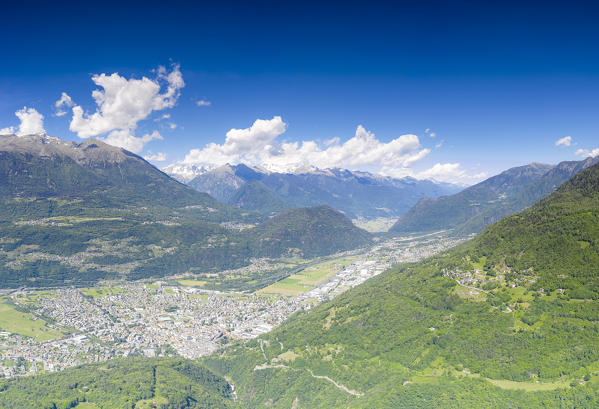 Aerial panoramic of Costiera Dei Cech, Rhaetian Alps and the town of Morbegno, Valtellina, Sondrio province, Lombardy, Italy