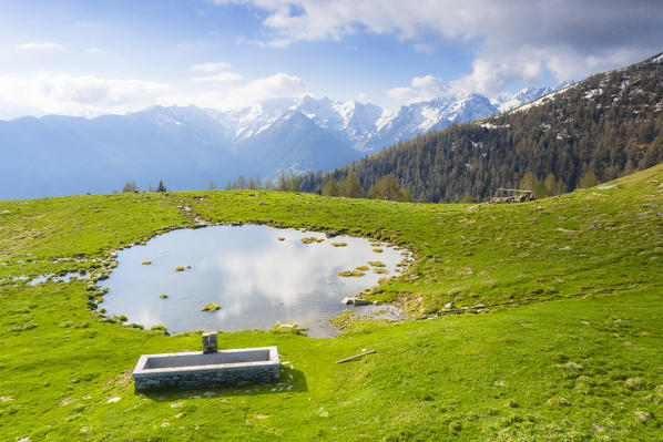 Small alpine lake in spring, Motta di Olano, Valgerola, Orobie Alps, Valtellina, Sondrio province, Lombardy, Italy