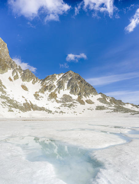 Ice melting at Lago Nero during spring thaw, Valchiavenna, Valle Spluga, Valtellina, Sondrio, Lombardy, Italy