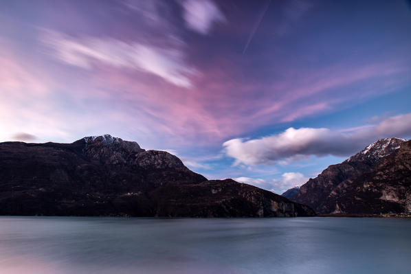 Clouds moved by the wind at sunset by the lake of Novate Mezzola, Valchiavenna,Lombardy Italy Europe