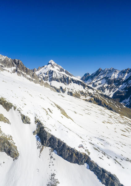 Clear sky over the snow capped Pizzo del Forno peak, Valmalenco,  Valtellina, Sondrio province, Lombardy, Italy