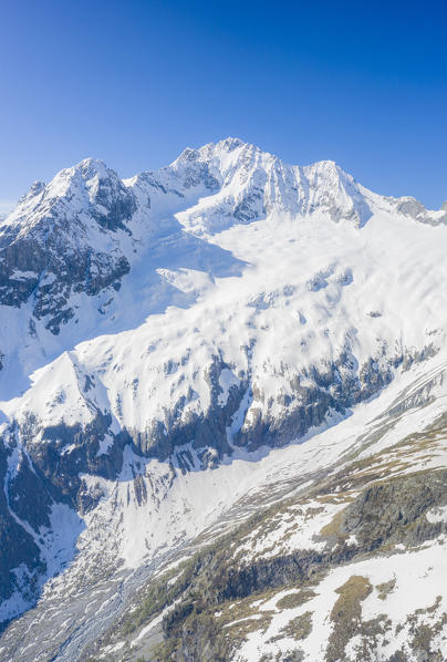 Panoramic of majestic Monte Disgrazia covered with snow, aerial view, Valmalenco, Valtellina, Sondrio province, Lombardy, Italy