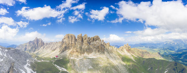 Panoramic of Alpe di Tires hut (Tierser Alpl) at feet of Denti di Terrarossa, aerial view, Dolomites, Trentino Alto Adige, Italy