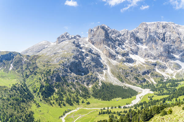 Sun over mountains of Schlern-Rosengarten, Sciliar-Catinaccio Nature Park in summer, Duron Valley, Dolomites, South Tyrol, Italy