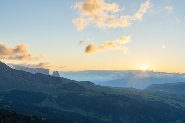 Sunset over Sciliar and Alpe di Siusi/Seiser Alm in summer, Dolomites, South Tyrol, Italy