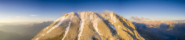 Aerial panoramic of Sassopiatto lit by sunset, Dolomites, Trentino-Alto Adige, Italy