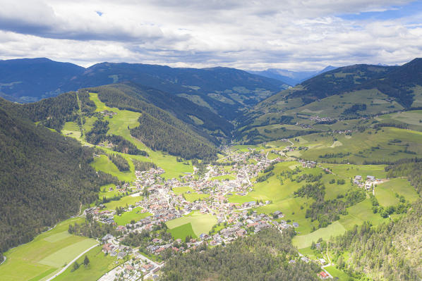 Aerial view of the alpine village of San Vigilio di Marebbe in summer, Dolomites, South Tyrol, Italy