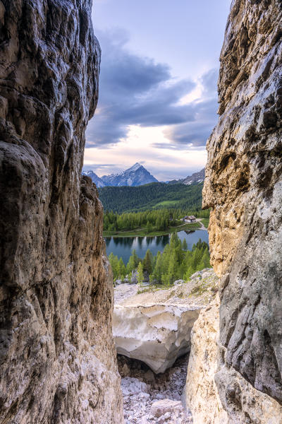 Rocks framing Rifugio Croda da Lago, Lake Federa and Antelao mountain, Ampezzo Dolomites, Belluno province, Veneto, Italy