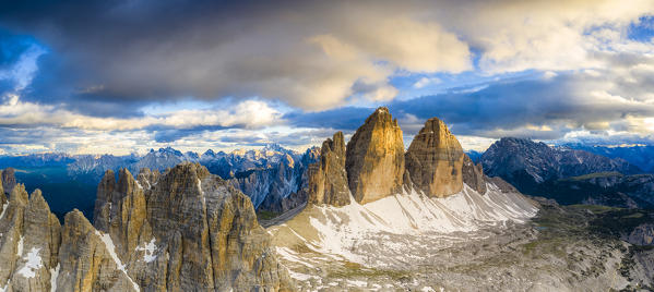 Aerial view of majestic peaks of Tre Cime di Lavaredo and Monte Paterno at sunset, Sesto Dolomites, South Tyrol, Italy