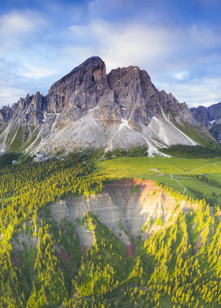 Aerial view of canyon covered by trees at feet of Sass De Putia (Peitlerkofel), Passo Delle Erbe, Dolomites, South Tyrol, Italy