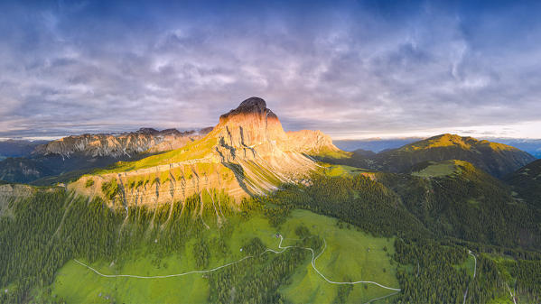 Cloudy sky at sunrise over Sass De Putia and Odle di Eores, Passo Delle Erbe (Wurzjoch), Dolomites, South Tyrol, Italy