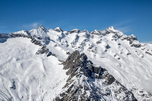 Aerial view of Cima del Calvo, Pizzo Ligoncio and Sfinge in winter. Valmasino, Valtellina Lombardy, Italy Europe 