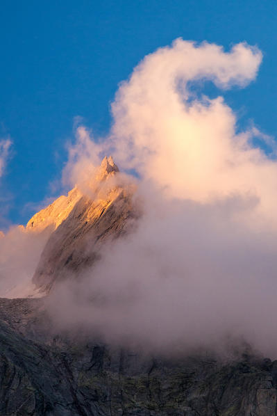 Sunset over Punta Allievi with a unusual cloud, Valmasino. Valtellina Lombardy, Italy Europe