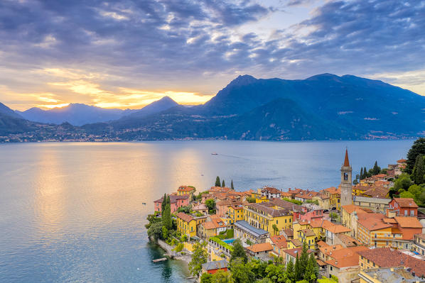 Burning sky at sunset over Varenna old town and Lake Como, Lecco province, Lombardy, Italy