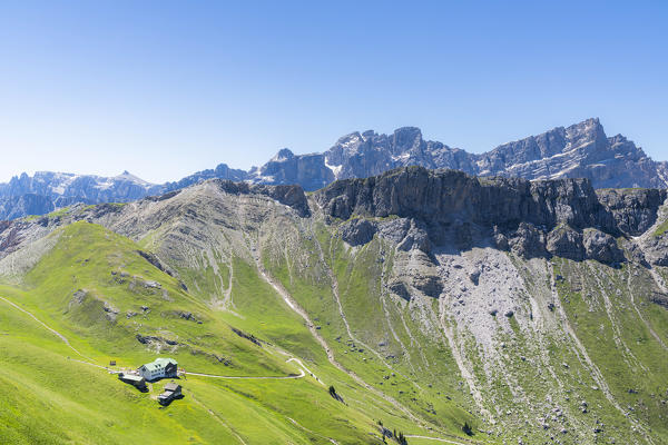 Aerial view of Rifugio Genova hut and Col di Poma at feet of the Odle peaks, Val di Funes, South Tyrol, Dolomites, Italy