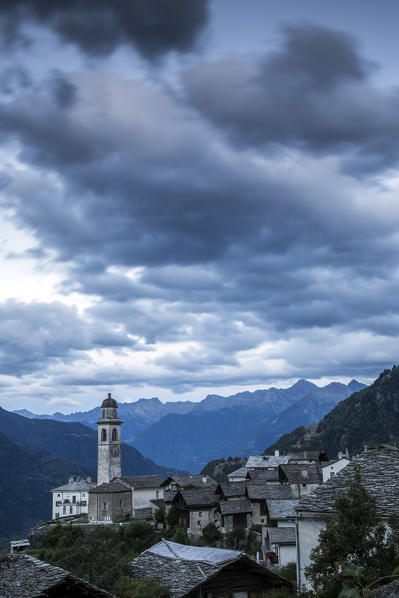 Threatening clouds in the sky at Soglio during the blue hour. Val Bregaglia Canton of Graubunden Switzerland Europe