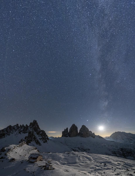 Moonlight on snowy Monte Paterno, Tre Cime di Lavaredo and Rifugio Locatelli, Sesto Dolomites, South Tyrol, Italy